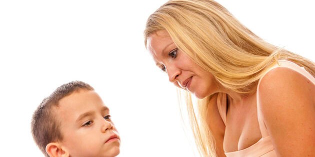 a mom with blonde hair talking to her young child