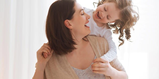 girl and her mother enjoy sunny morning